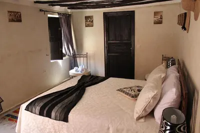 a bedroom with a bed in a room at Riad Le Bel Oranger in Marrakech
