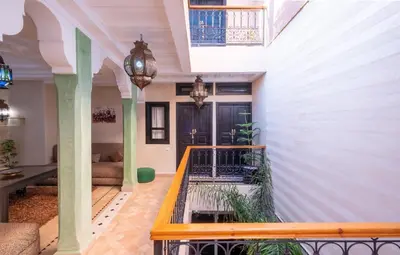 a hallway of a house with a balcony at Riad Elite in Marrakech