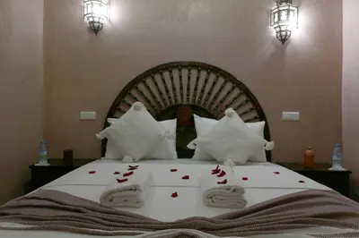 a bedroom with a bed with red hearts on it at Riad Elite in Marrakech
