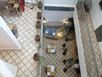 an overhead view of a tile floor with potted plants at Riad Papadou in Marrakech