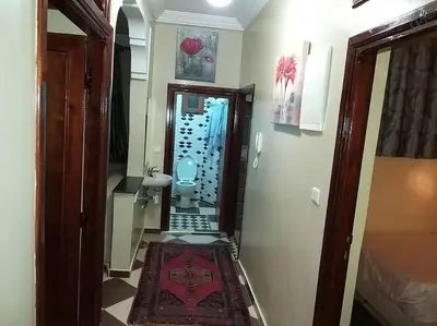 a hallway with a bathroom with a toilet in a room at Marrakech Family appartements in Marrakech
