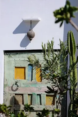 a house with a birdbath on the side of it at Riad L'Atelier in Marrakech