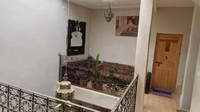 a staircase with a railing with plants on it at Riad Taziri in Marrakech