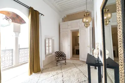 a room with a zebra chair and a window at Riad Nomada Marrakech in Marrakech