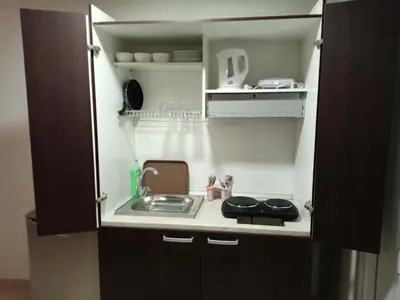 a small kitchen with a sink and a stove at Appartement 33 in Marrakech