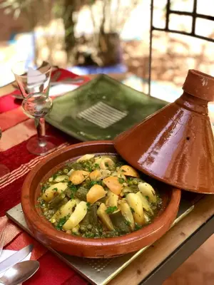 a bowl of food on top of a table at Riad Zahir in Marrakech