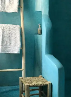 a blue room with a ladder and a stool at Riad Zahir in Marrakech