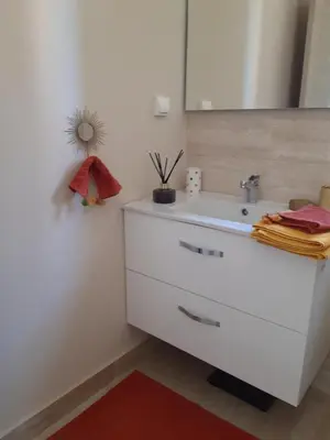 a bathroom with a white sink and a mirror at Jade Golf City in Marrakech