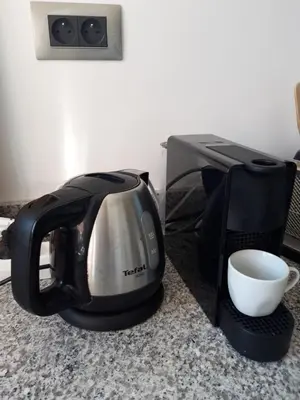 a coffee maker and a toaster on a counter at Jade Golf City in Marrakech