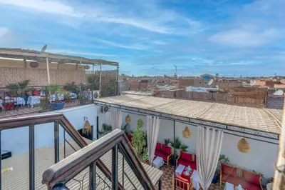 a balcony with a view of a city at Riad des remparts Marrakech in Marrakech