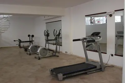 a gym with several exercise equipment in a room at Studio Salmiya Dune in Marrakech