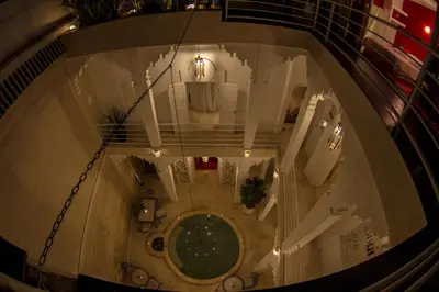 an overhead view of a building with a clock at Riad THALGE in Marrakech
