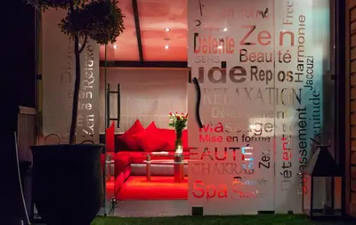 a living room with a red couch and a table at Medina Loft & Spa in Marrakech