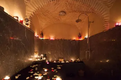 a room with a shower with candles on the floor at Medina Loft & Spa in Marrakech