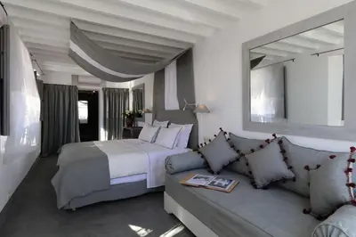 a bedroom with a bed and a couch at Dar Seven in Marrakech