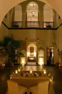 a large room with a table with candles on it at Dar Seven in Marrakech