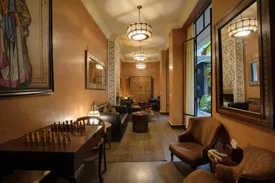 a lobby with a chess board on a table at Riad Kheirredine in Marrakech