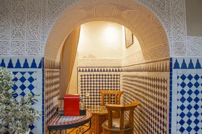 a room with two chairs and a table at Riad Dar Tamlil in Marrakech