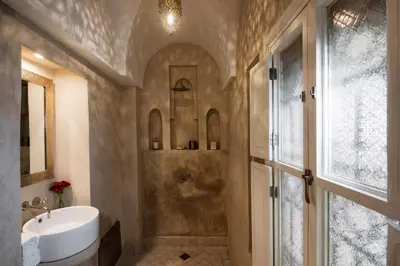 a bathroom with a shower and a sink and a tub at Riad Spice by Marrakech Riad in Marrakech
