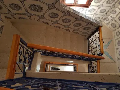 a room with a fireplace and a window at Zaitouna, Quiet apartment, Modern in Marrakech