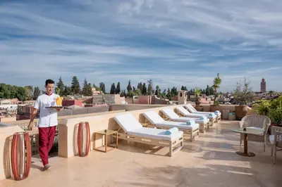 a man standing on the roof of a building at Riad 72 in Marrakech