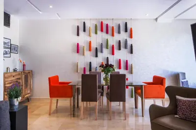 a dining room with a table and chairs at VILLA Waky & Golf - Jardin de l'Atlas in Marrakech