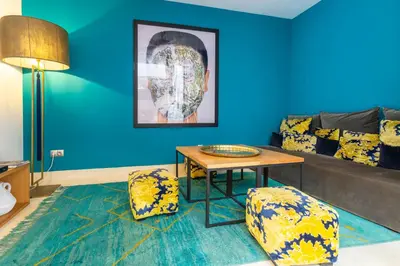 a living room with a couch and a table at Douiria13 in Marrakech