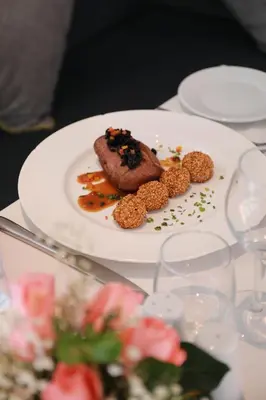 a plate with a piece of food on a table at Kenzi Rose Garden in Marrakech