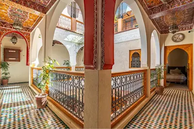 an ornate hallway with a balcony in a building at RIAD VILLA SIDI BABA in Marrakech