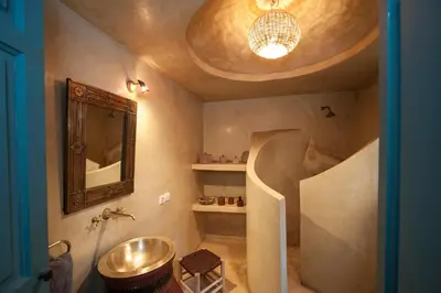 a bathroom with a sink and a mirror at Riad La Clé de la Medina, location en exclusivité de tout le riad in Marrakech
