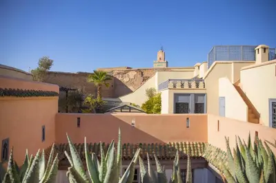 a view of a building with a mountain in the background at Riad Les Hirondelles Boutique Hotel and Spa in Marrakech