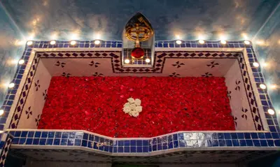 a room full of red balls with lights on it at Riad Touda in Marrakech