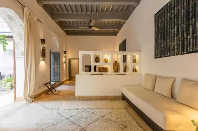 a living room with a couch and a table at Riad Tchaikana in Marrakech