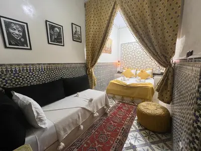 a living room with a couch and a table at Dar KHALID in Marrakech
