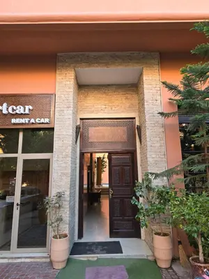 an entrance to a store with a brown door at Charming Marrakech Apartement in Marrakech