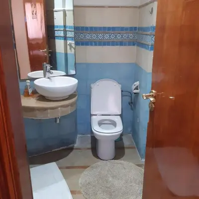 a bathroom with a toilet and a sink at Appartement Patio centre Gueliz in Marrakech