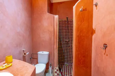 a bathroom with a toilet and a shower at Riad Saba in Marrakech