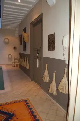 a hallway with skeletons on the walls of a room at riad anrich in Marrakech