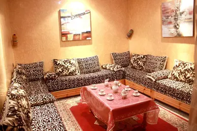 a living room with couches and a coffee table at Charming house, Medina Marrakech in Marrakech