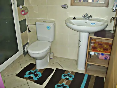 a bathroom with a toilet and a sink at Appartement Aïda in Marrakech