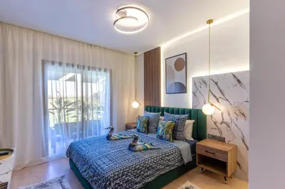 a bedroom with a bed with two rubber ducks on it at Cozy Golf Apartment Wifi 4k-TV Netflix in Marrakech