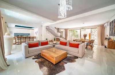 a living room with two couches and a table at Villa White High-Standing - Breakfast in Marrakech