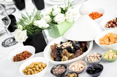 a table topped with bowls of different types of food at Dar Assiya in Marrakech