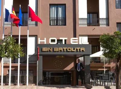 a man standing in front of a hotel at Hôtel Ibn Batouta in Marrakech