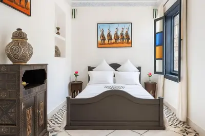 a bedroom with a bed and a fireplace at Riad 111 & Spa in Marrakech