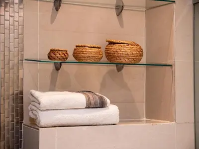 a display case with towels and baskets on a wall at Coup de cœur à Marrakech - idéal famille et couple in Marrakech