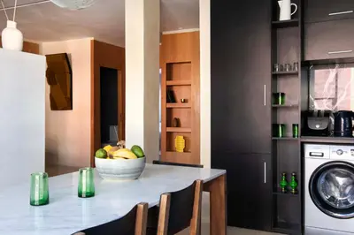 a kitchen with a counter with a bowl of fruit at Appartements Brummell Marrakech in Marrakech