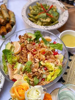 a table with three plates of food on it at Riad Le Pèlerin in Marrakech