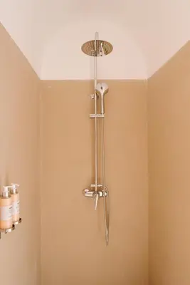 a shower head in a bathroom with a ceiling at Riad Le Pèlerin in Marrakech