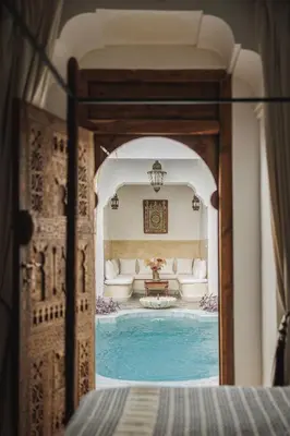 a view of a room with a swimming pool at Riad Alkemia en exclusivité in Marrakech